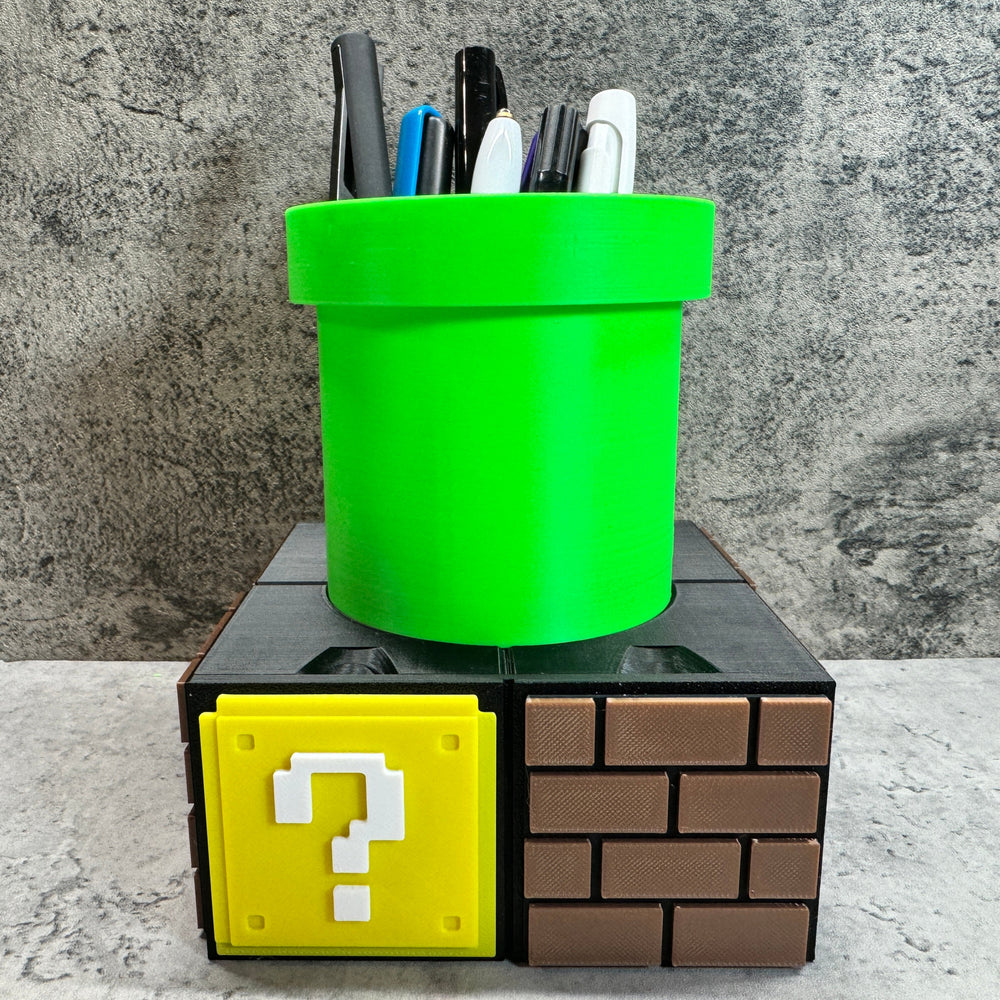 
                  
                    a green cup sitting on top of a block with a question mark on it
                  
                