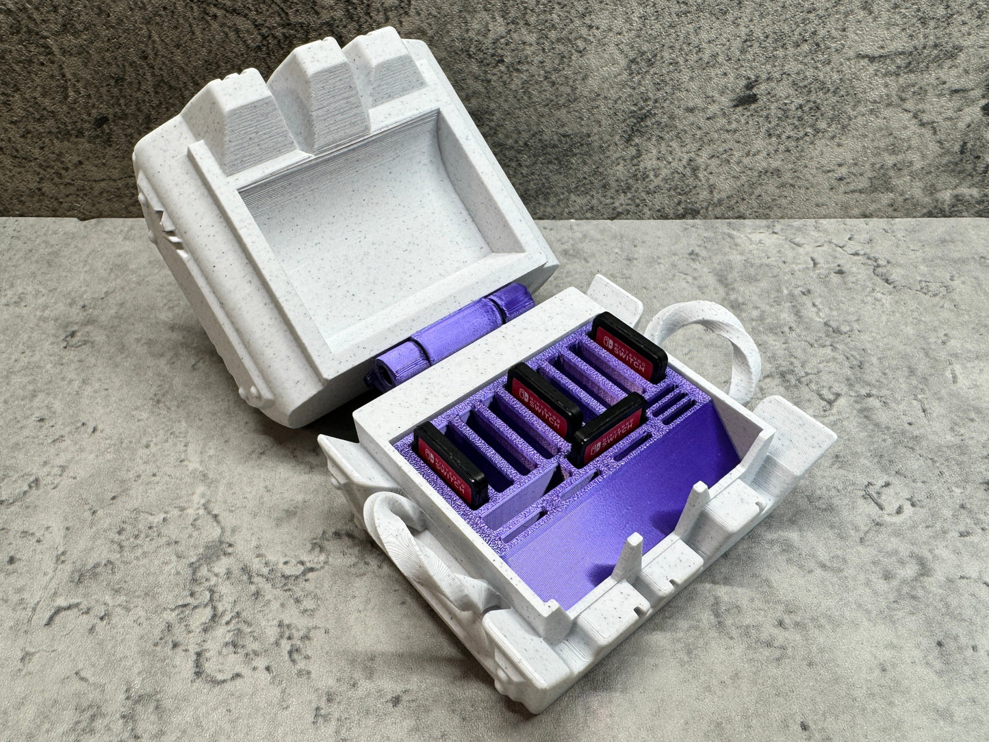 a purple and white box with a purple handle