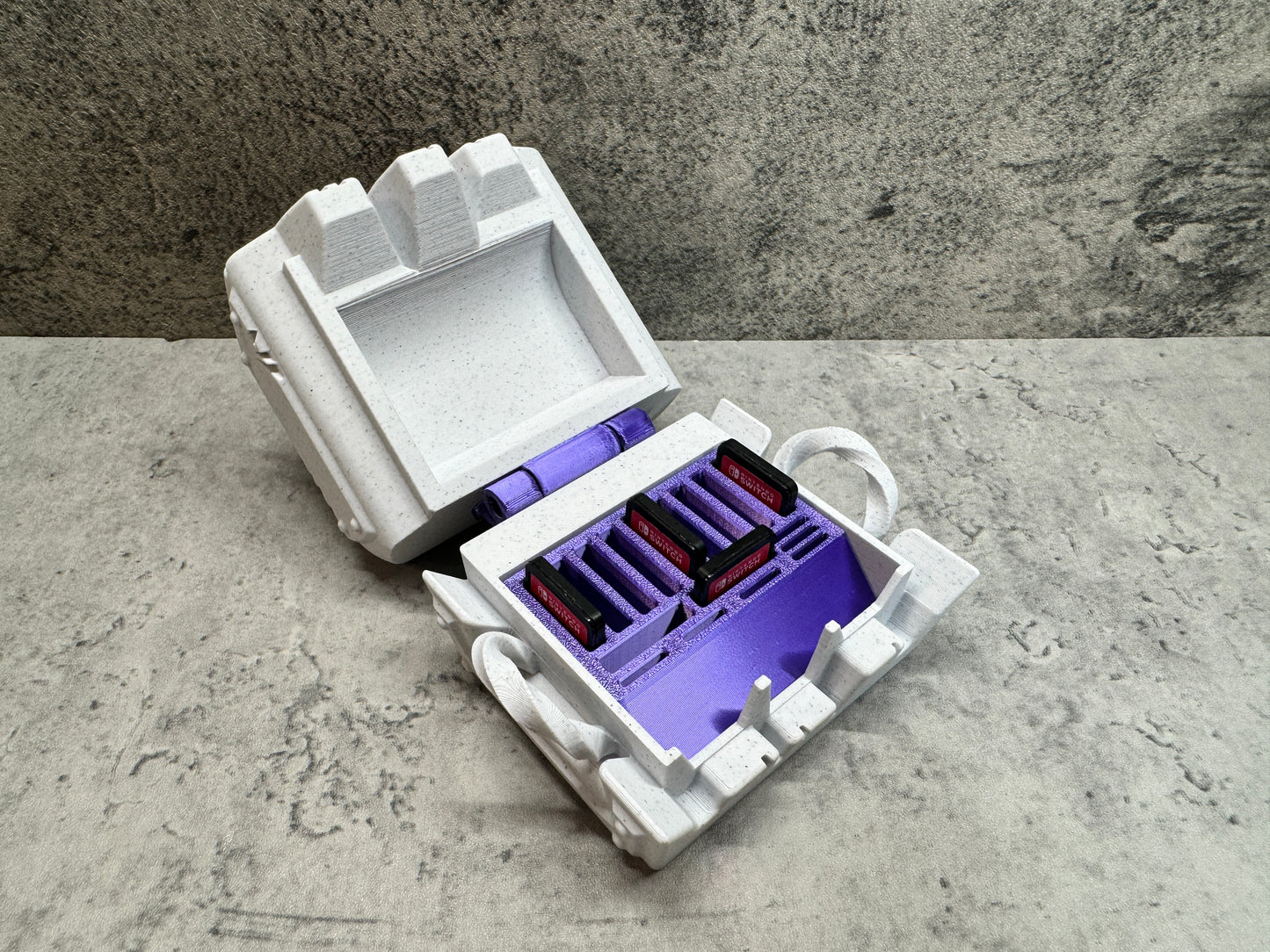 
                  
                    a purple and white box with a purple handle
                  
                