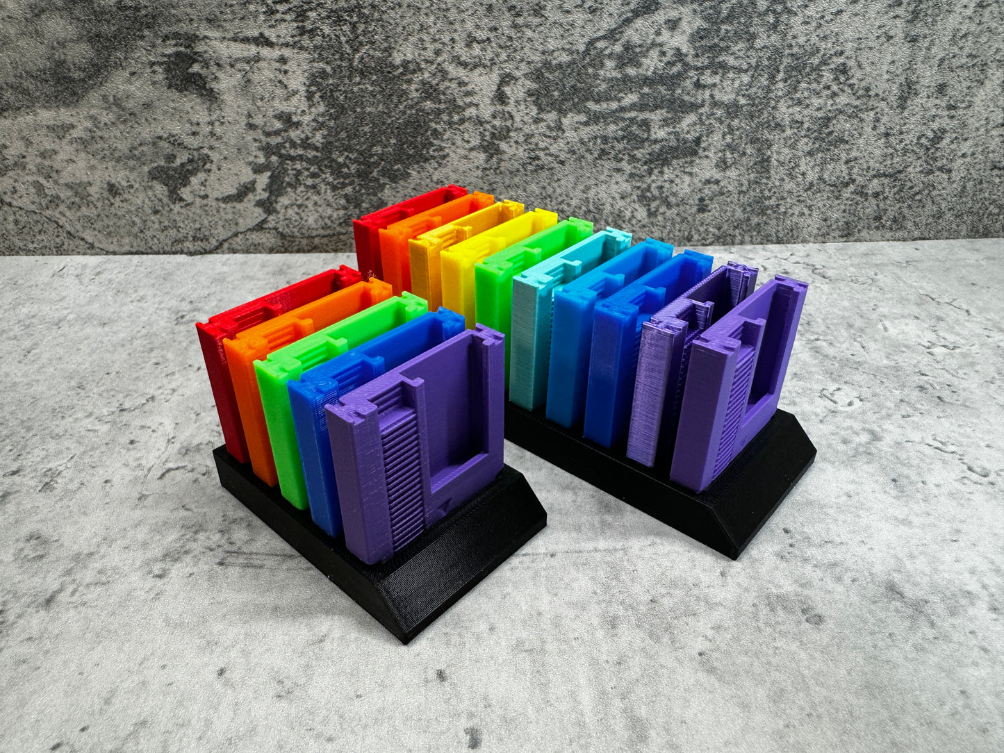 
                  
                    a group of colorful folders sitting on top of a table
                  
                