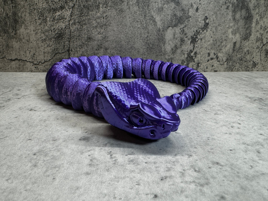 a purple coiled object sitting on top of a table