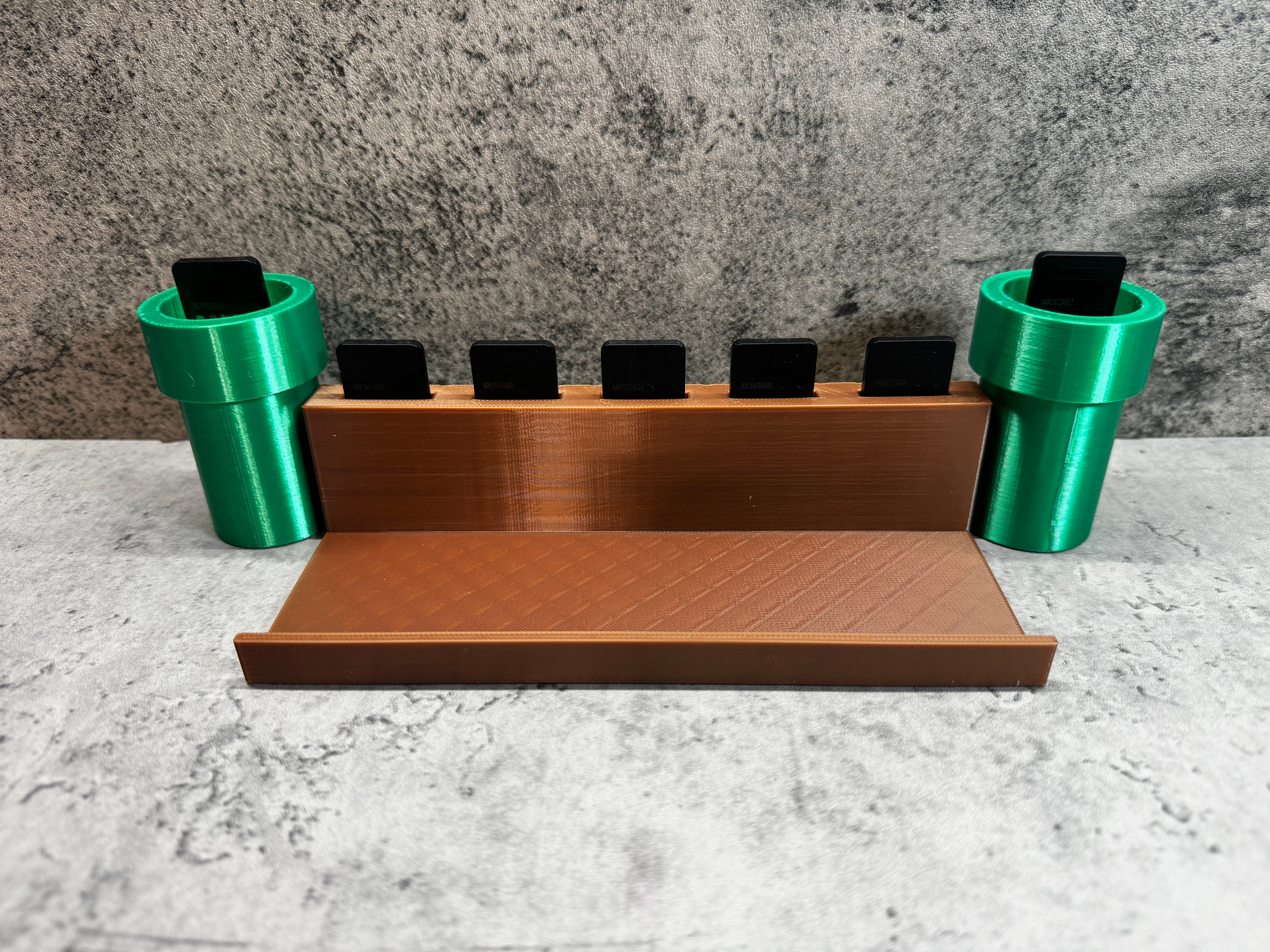 a set of three green cups sitting on top of a counter