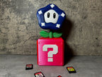 a toy with a question mark on top of it