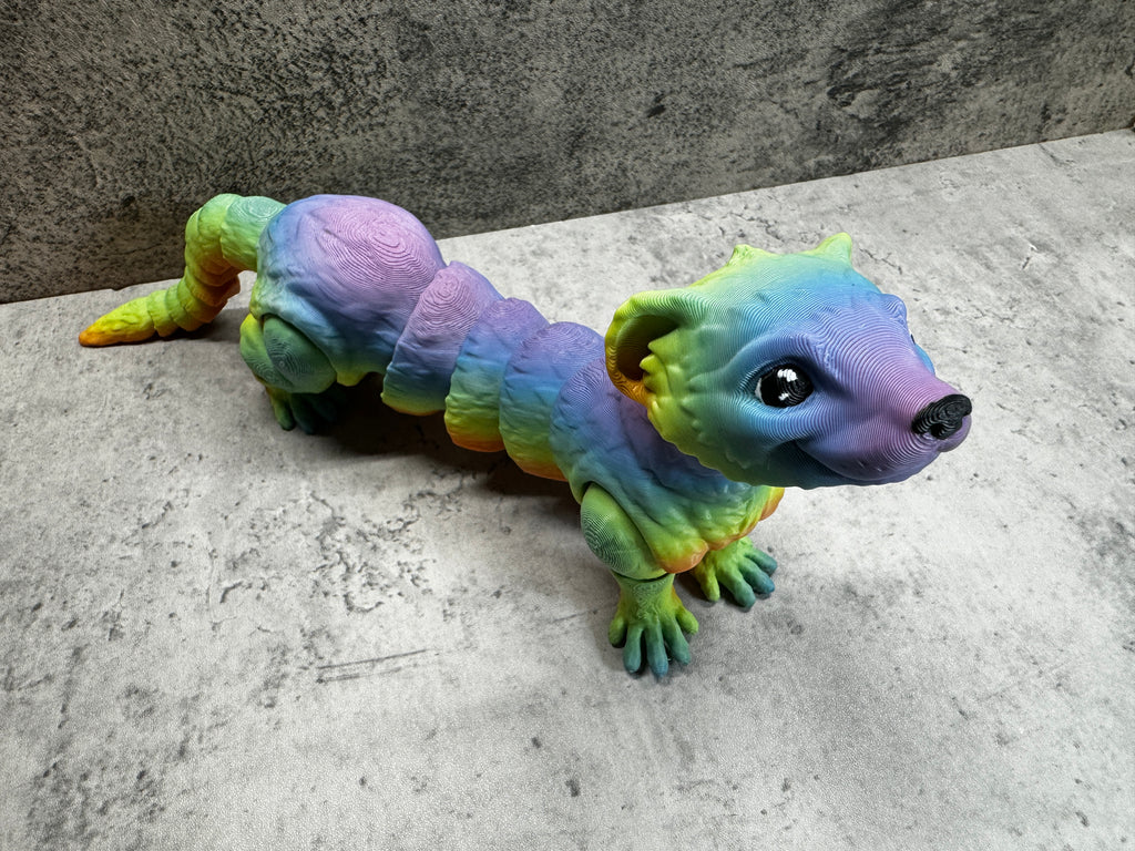a toy lizard is sitting on the floor