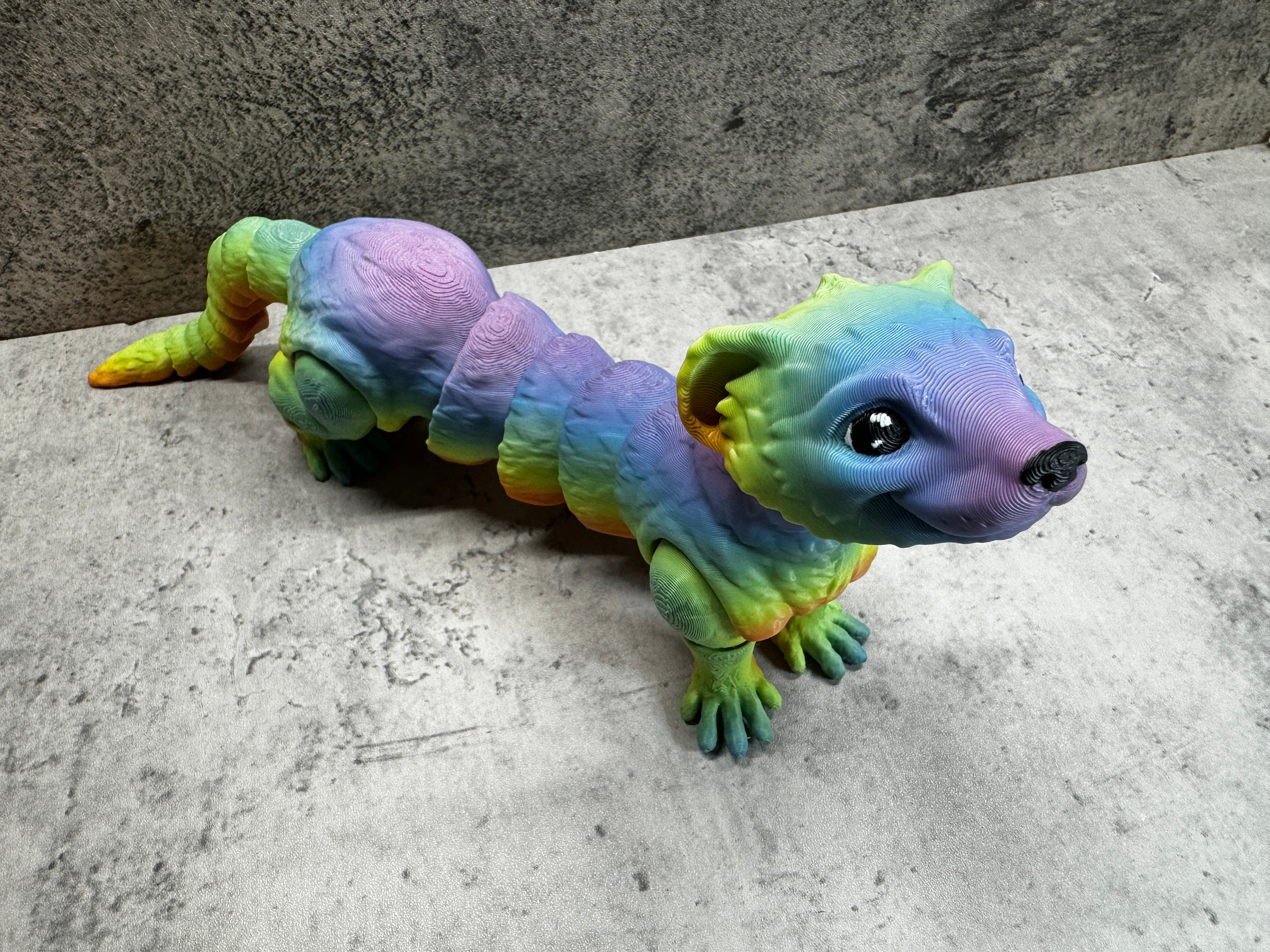 a toy lizard is sitting on the floor