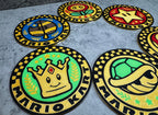 a set of four circular rugs with different logos on them