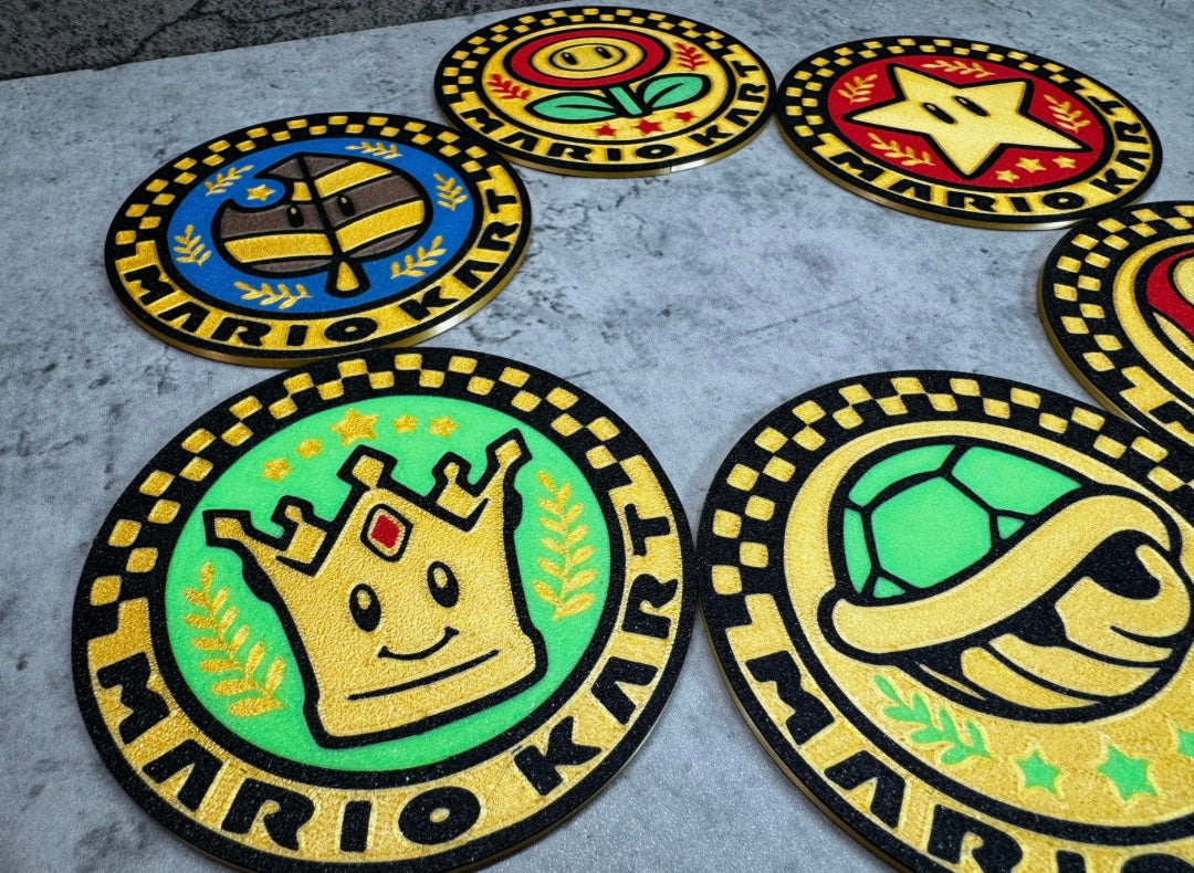 a set of four circular rugs with different logos on them