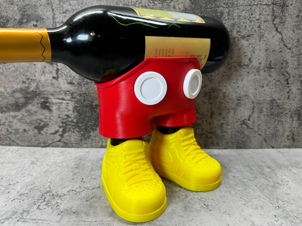 a wine bottle holder made to look like a mickey mouse