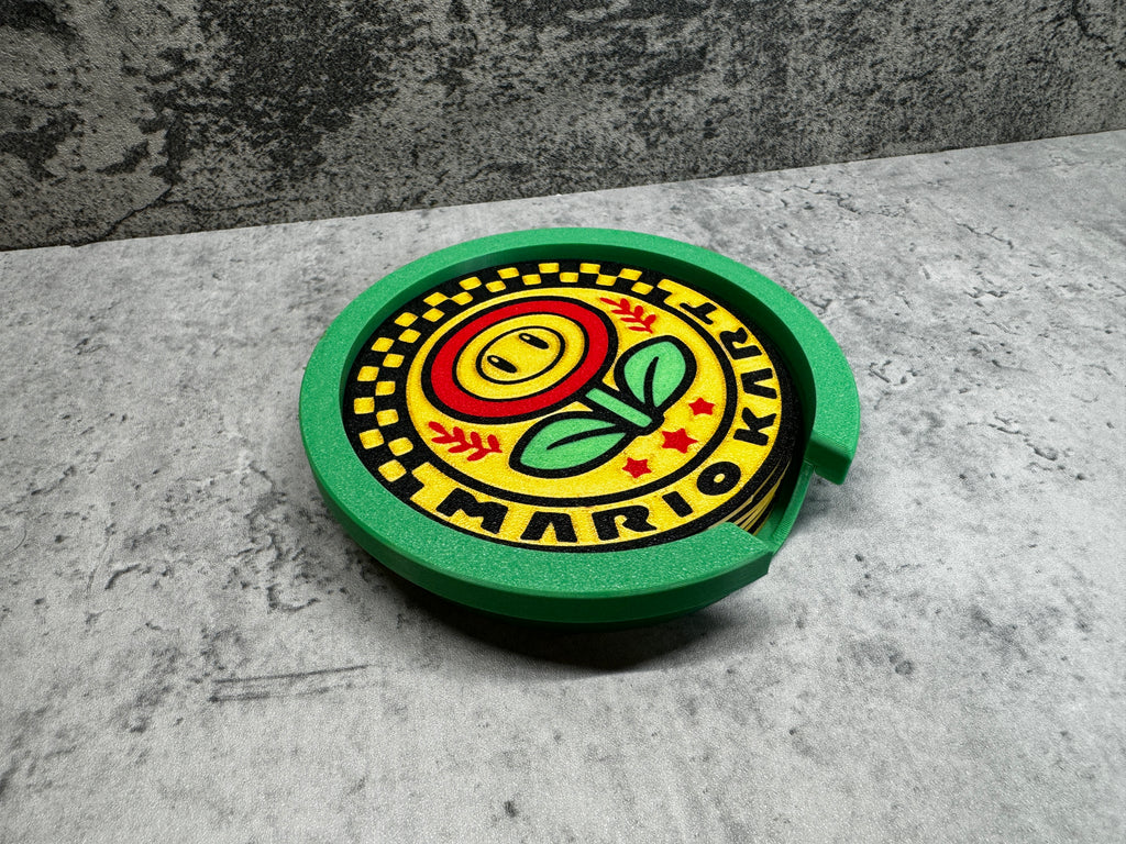 a green and yellow plate with a flower on it