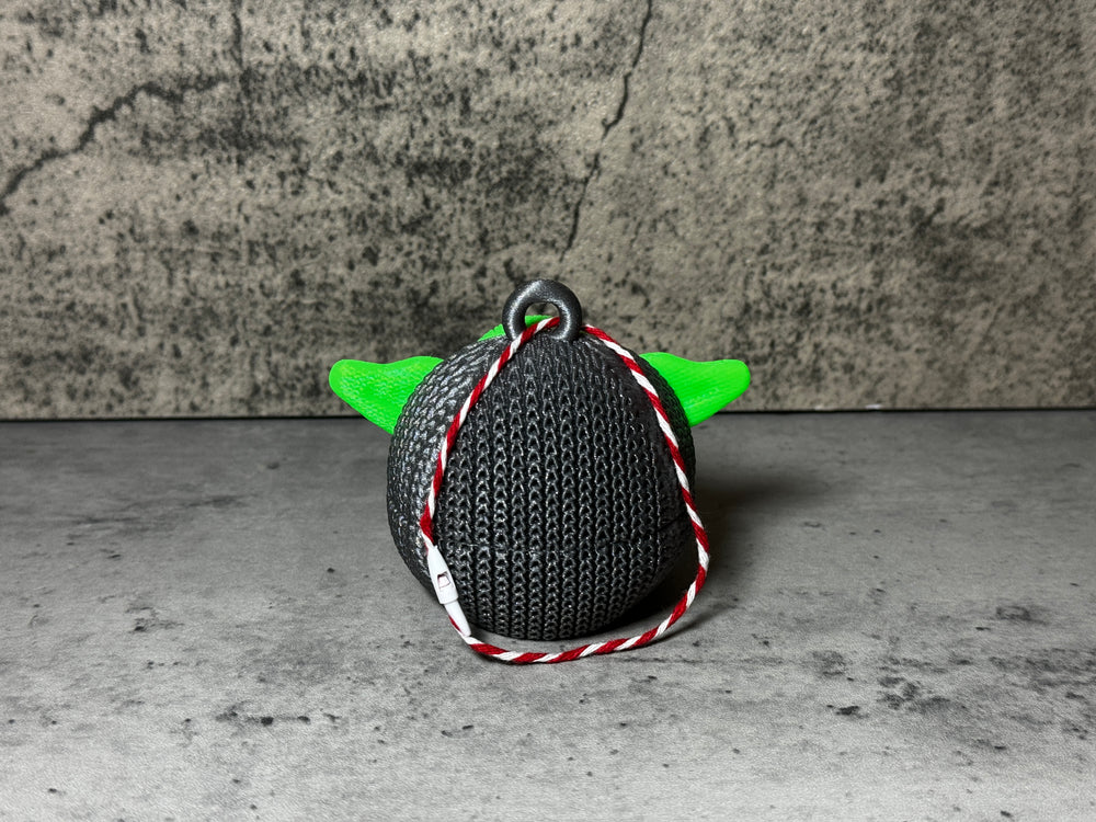 
                  
                    a knitted bag with a green yoda head on it
                  
                