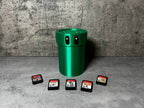a green trash can sitting next to four game cards