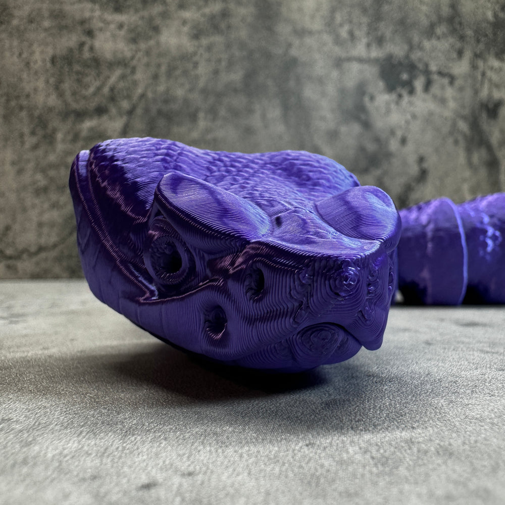 
                  
                    a purple shoe hanging on the side of a wall
                  
                
