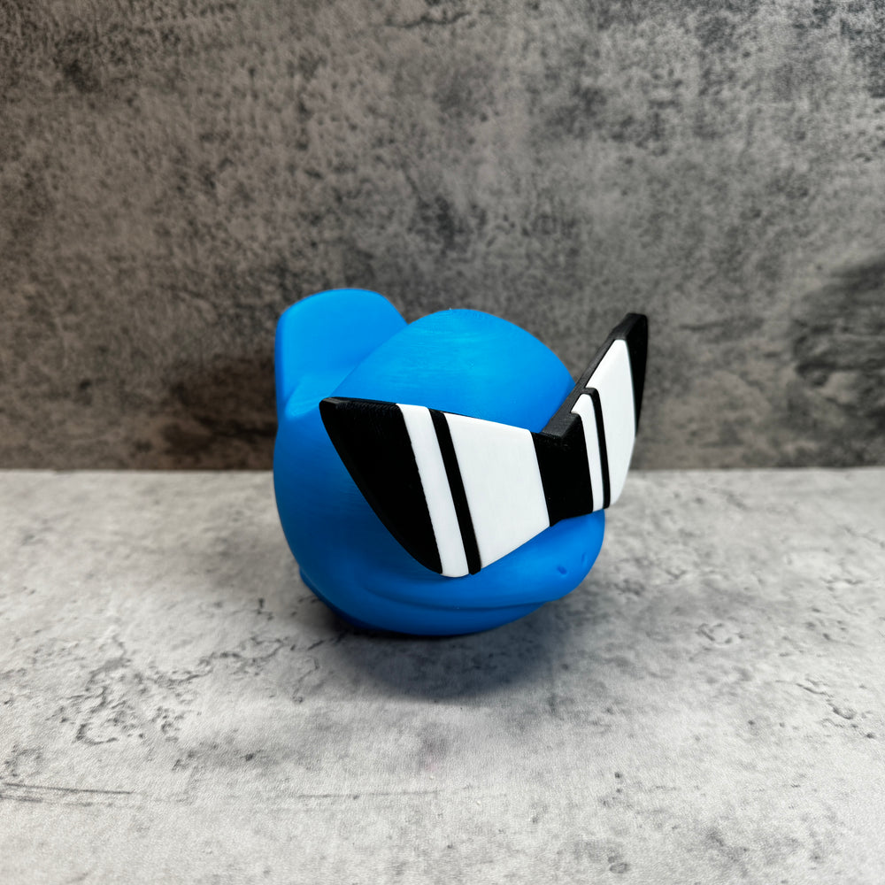 
                  
                    a blue toy with black and white stripes on it
                  
                