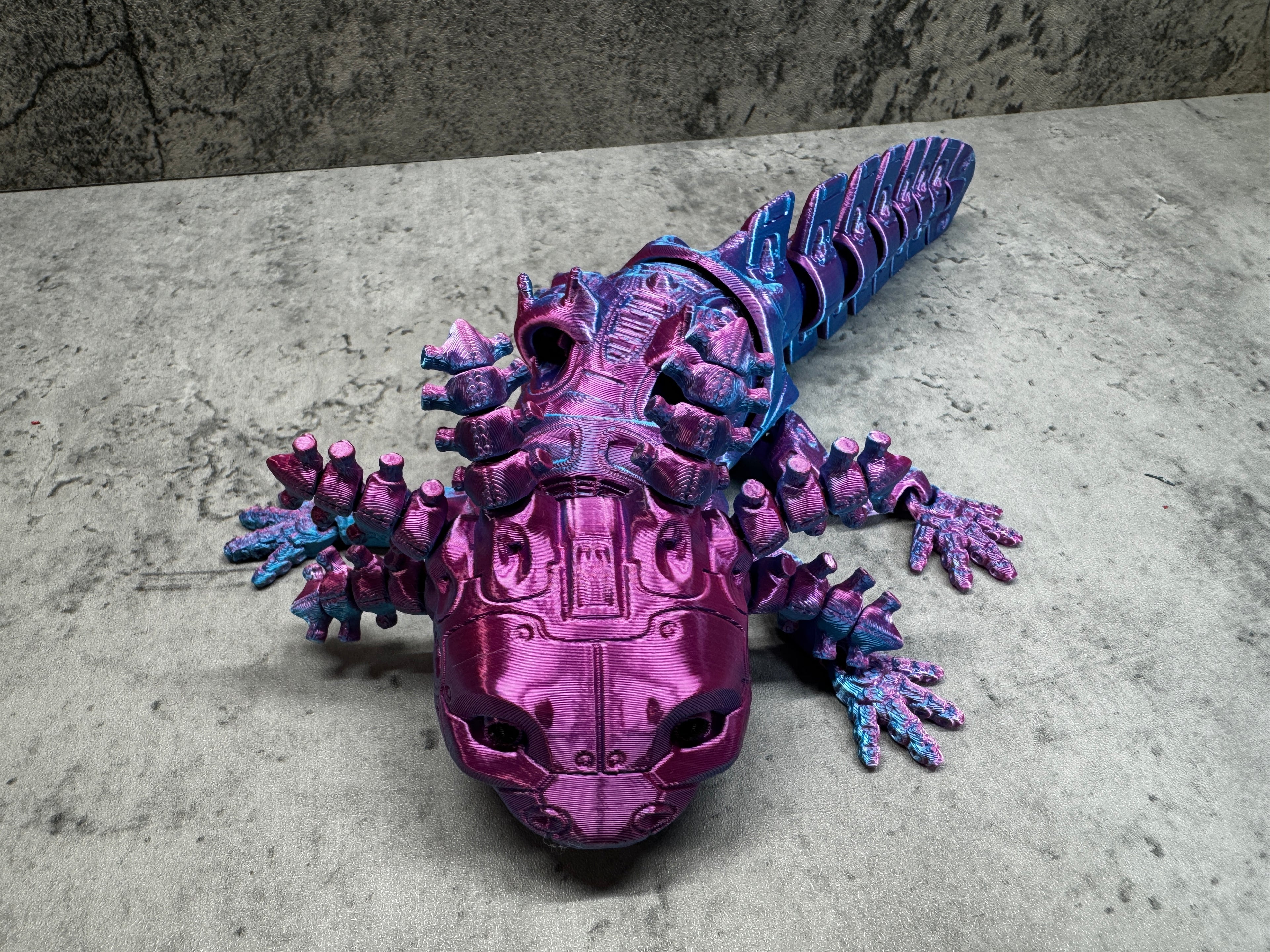 a purple toy with spikes on it laying on the ground