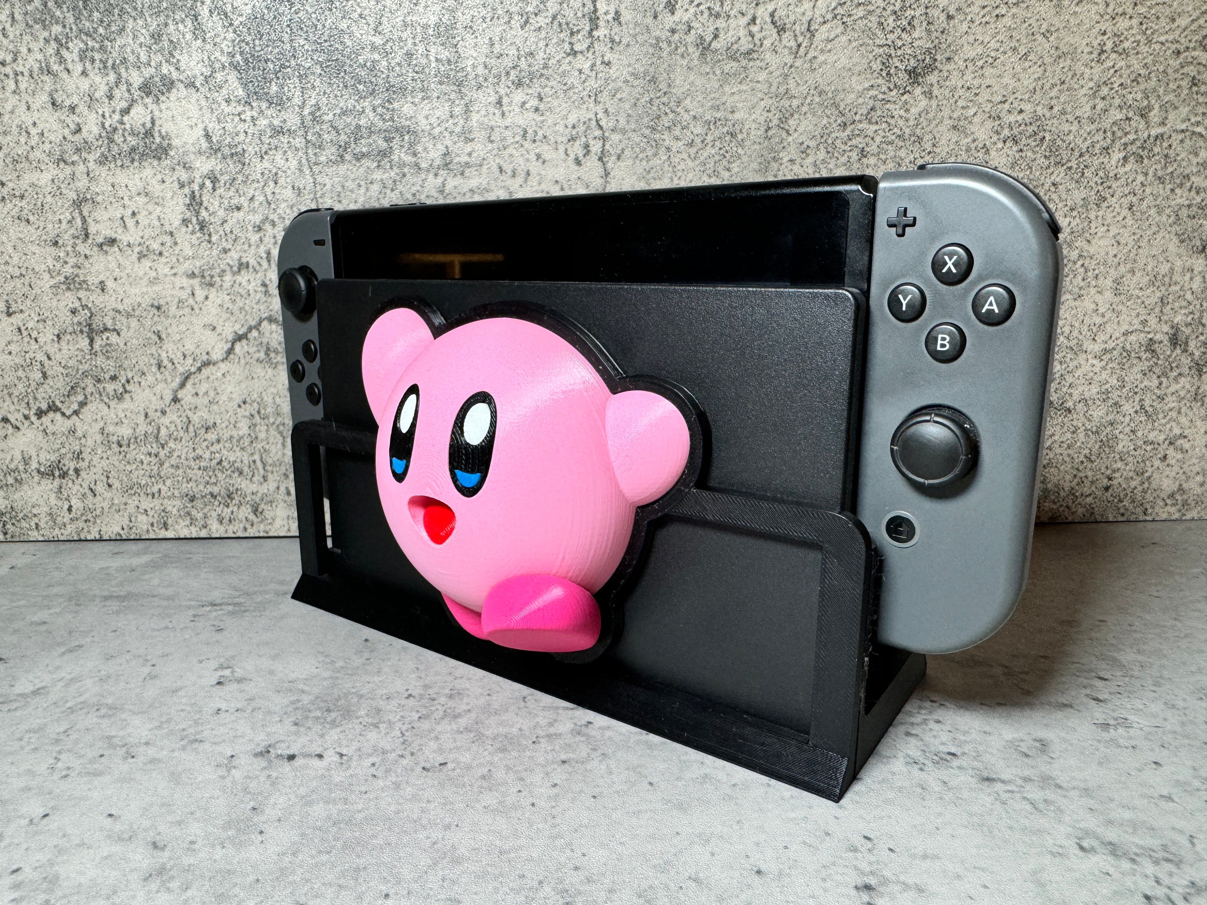 a nintendo wii game controller with a pink pig head