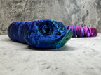 a skateboard with a blue and purple design on it