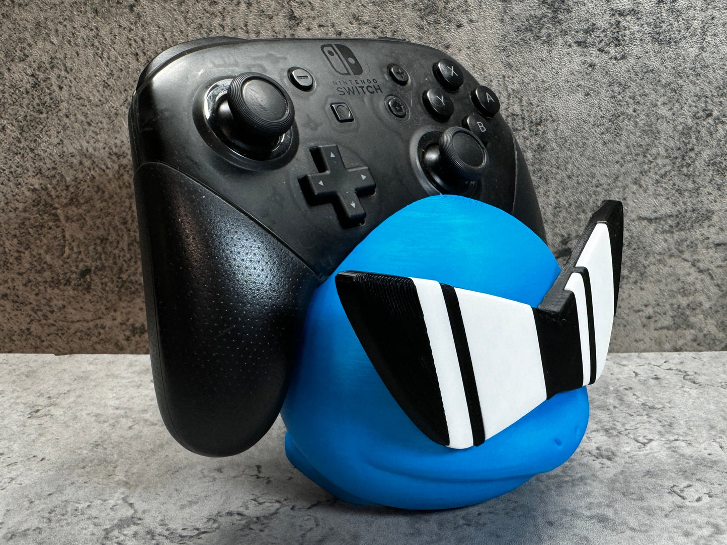 a close up of a controller and a ball