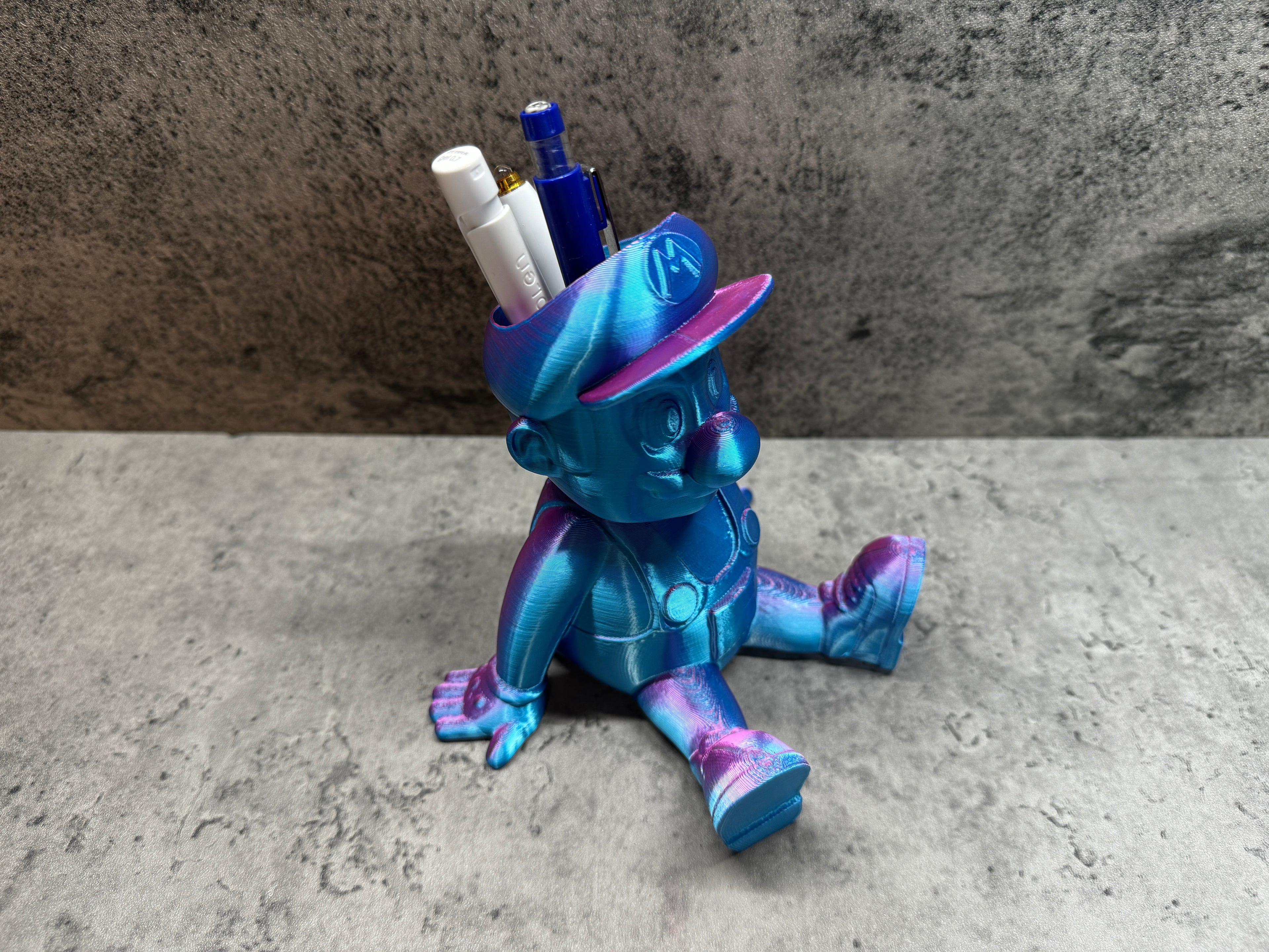 a blue and purple toy sitting on top of a table