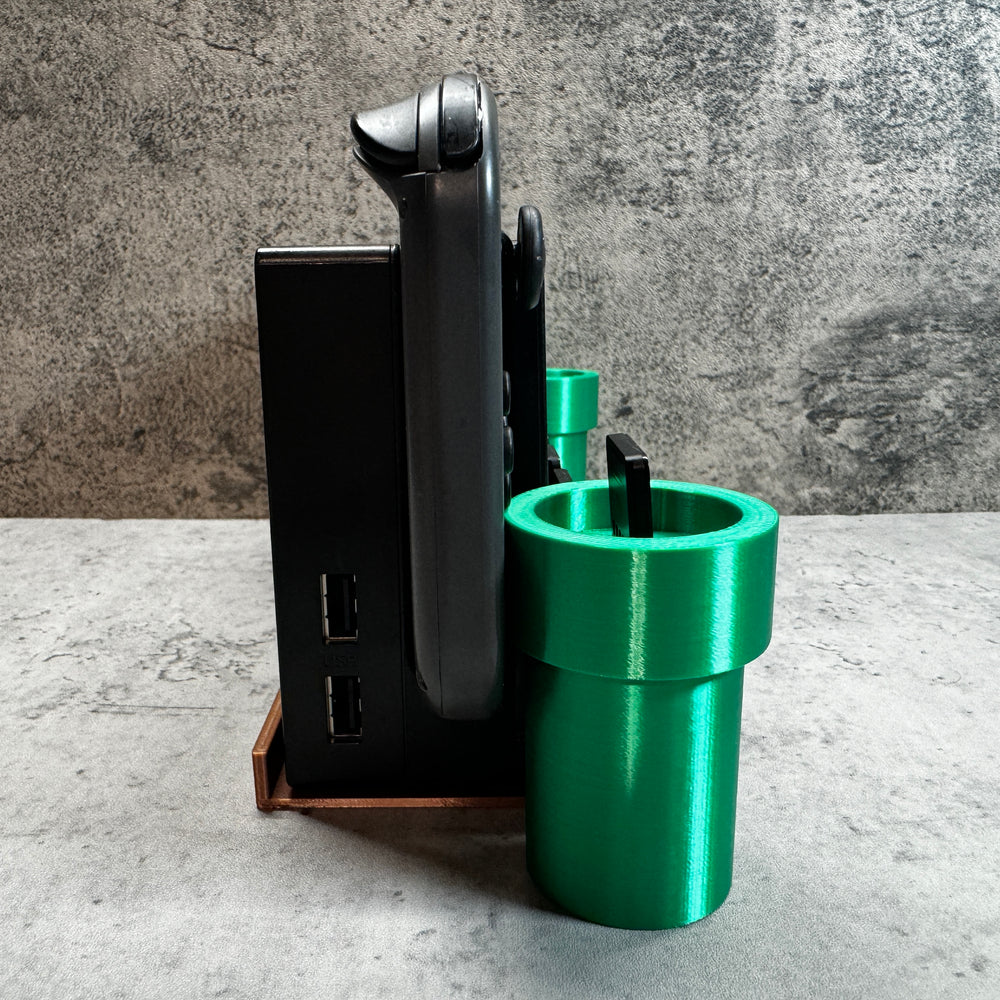 
                  
                    a couple of green cups sitting next to each other
                  
                