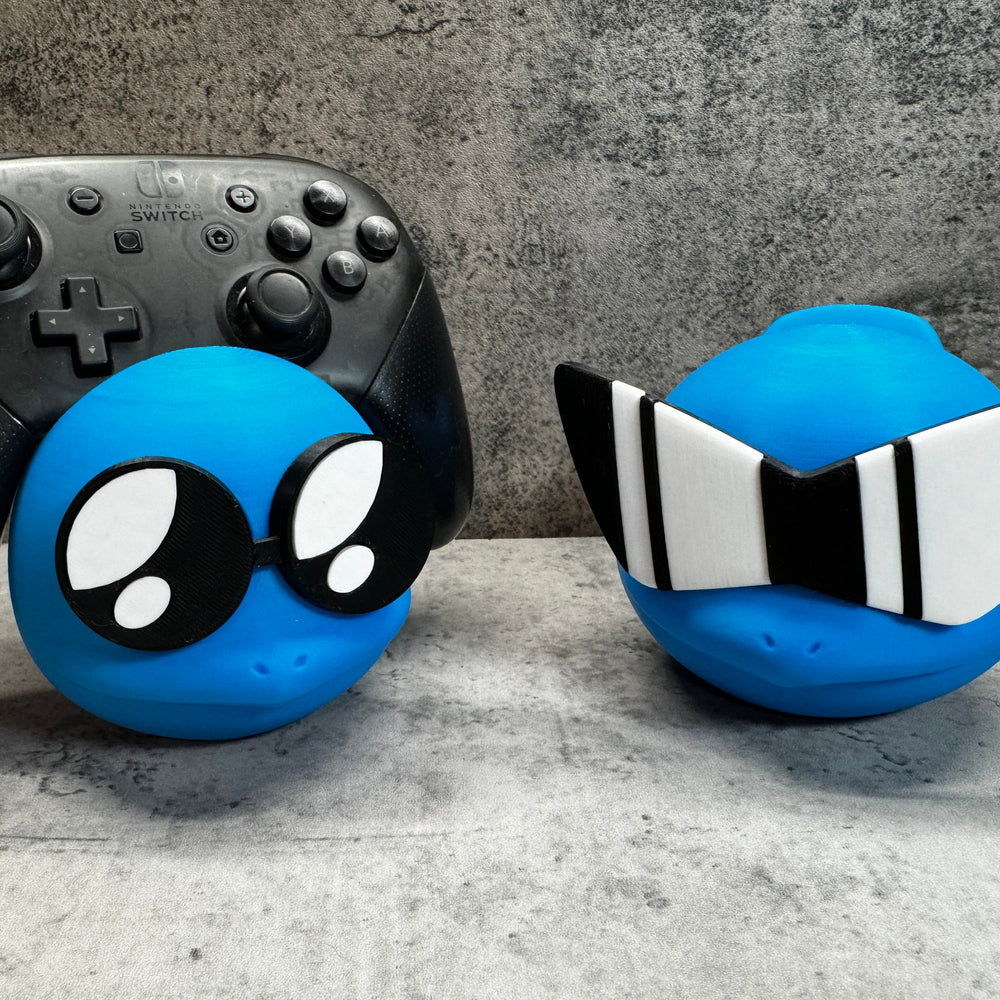 
                  
                    two video game controllers sitting next to each other
                  
                