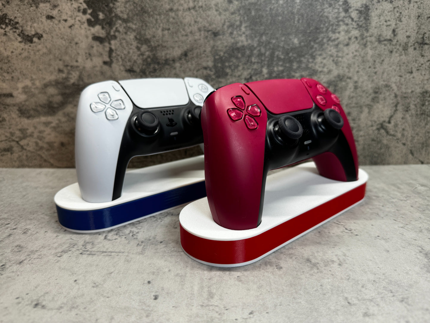 
                  
                    two nintendo wii game controllers sitting on top of each other
                  
                