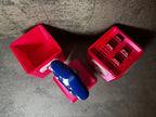 a red toy truck with a blue toy car next to it