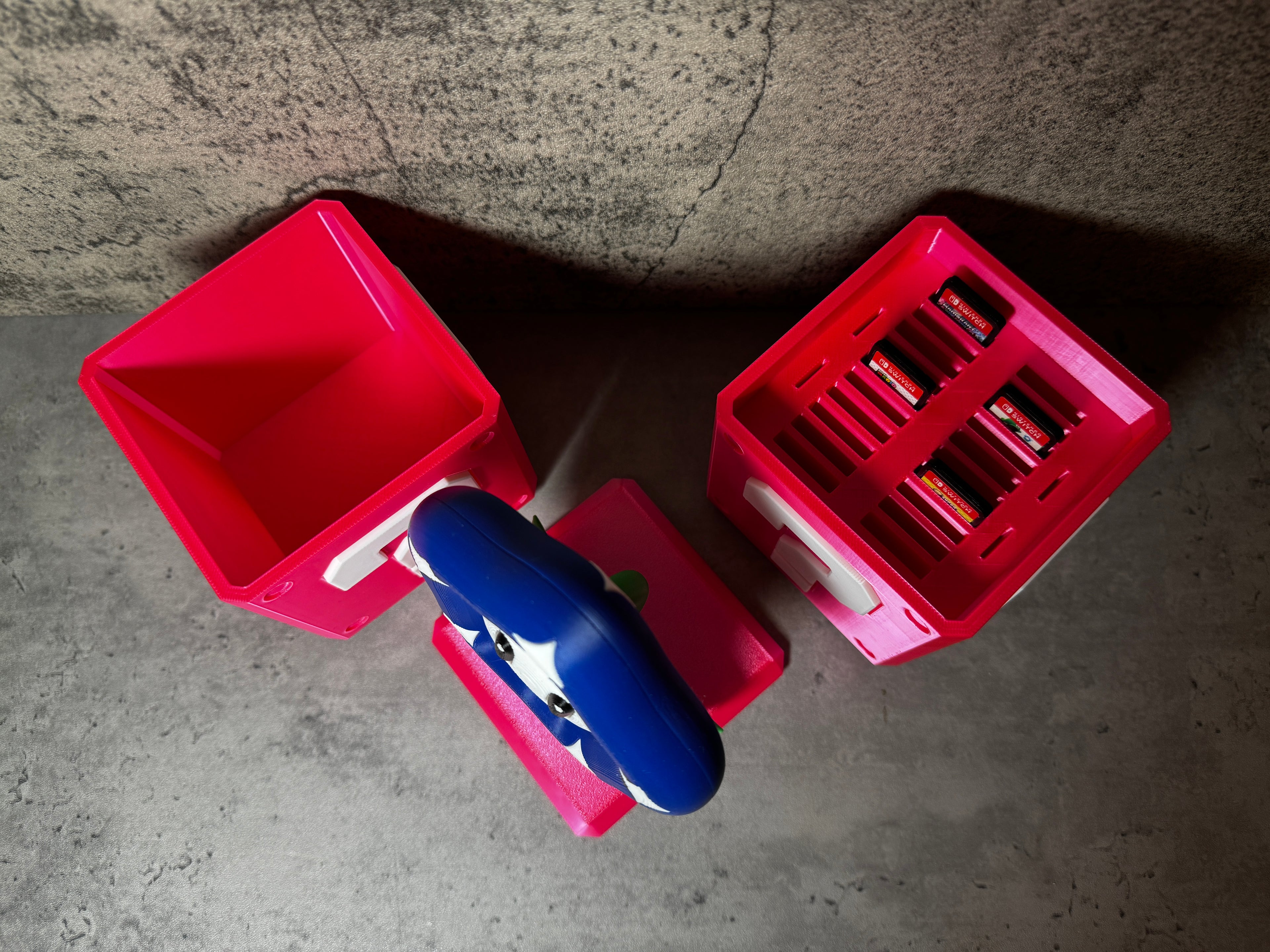 a red toy truck with a blue toy car next to it