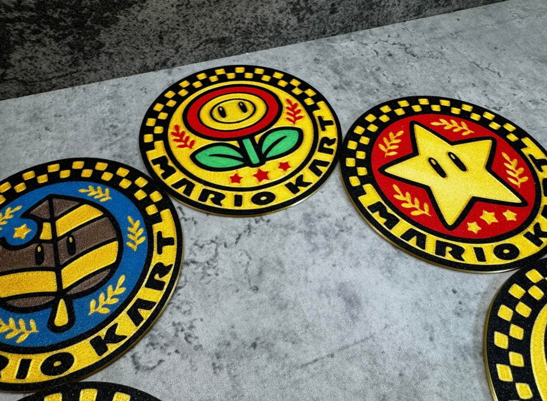 a group of four badges sitting on top of a floor