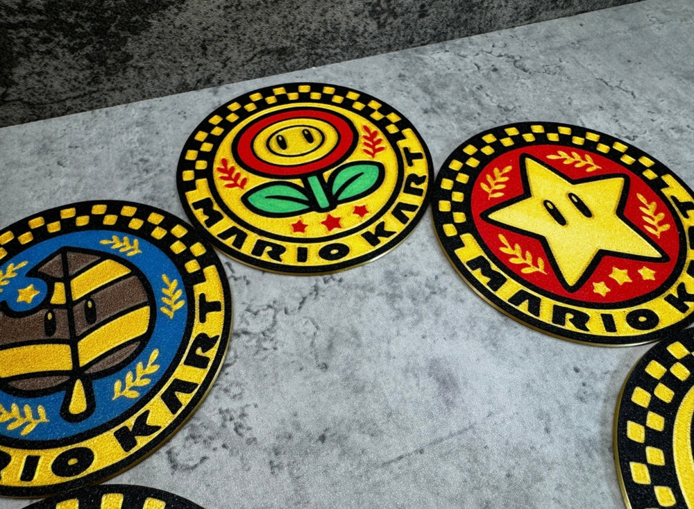 
                  
                    a group of four badges sitting on top of a floor
                  
                