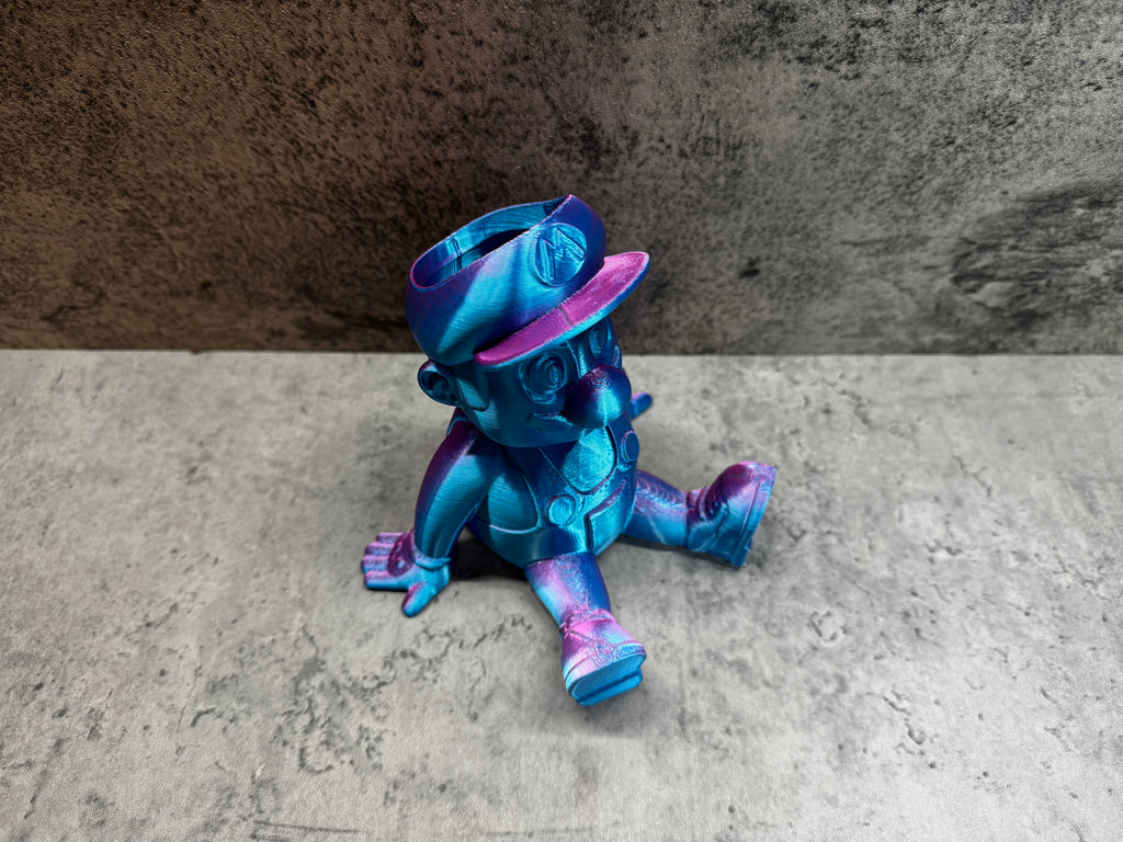 a blue and purple toy sitting on the ground