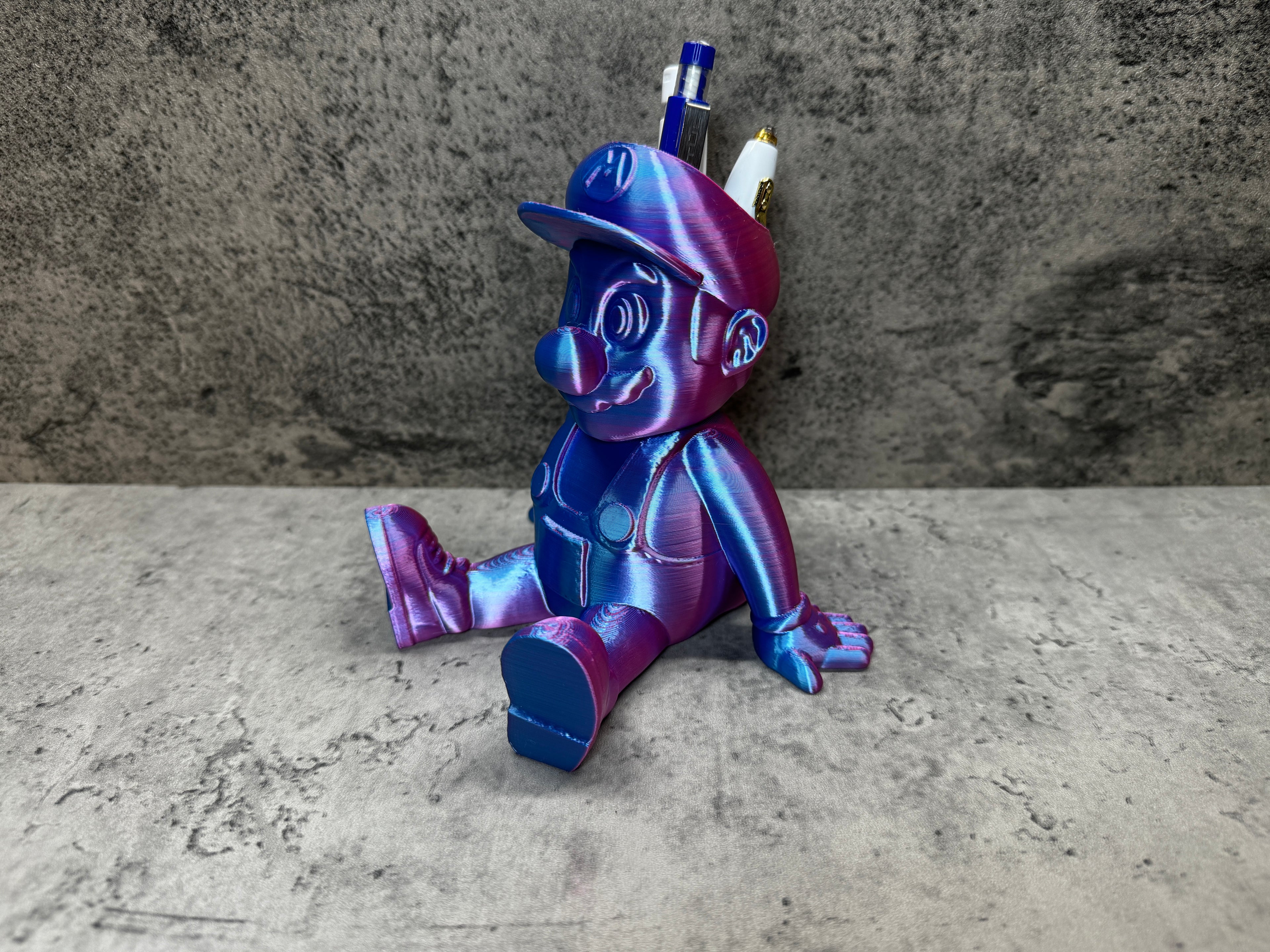a purple and blue toy sitting on top of a table