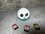 a white robot sitting next to a group of cell phones