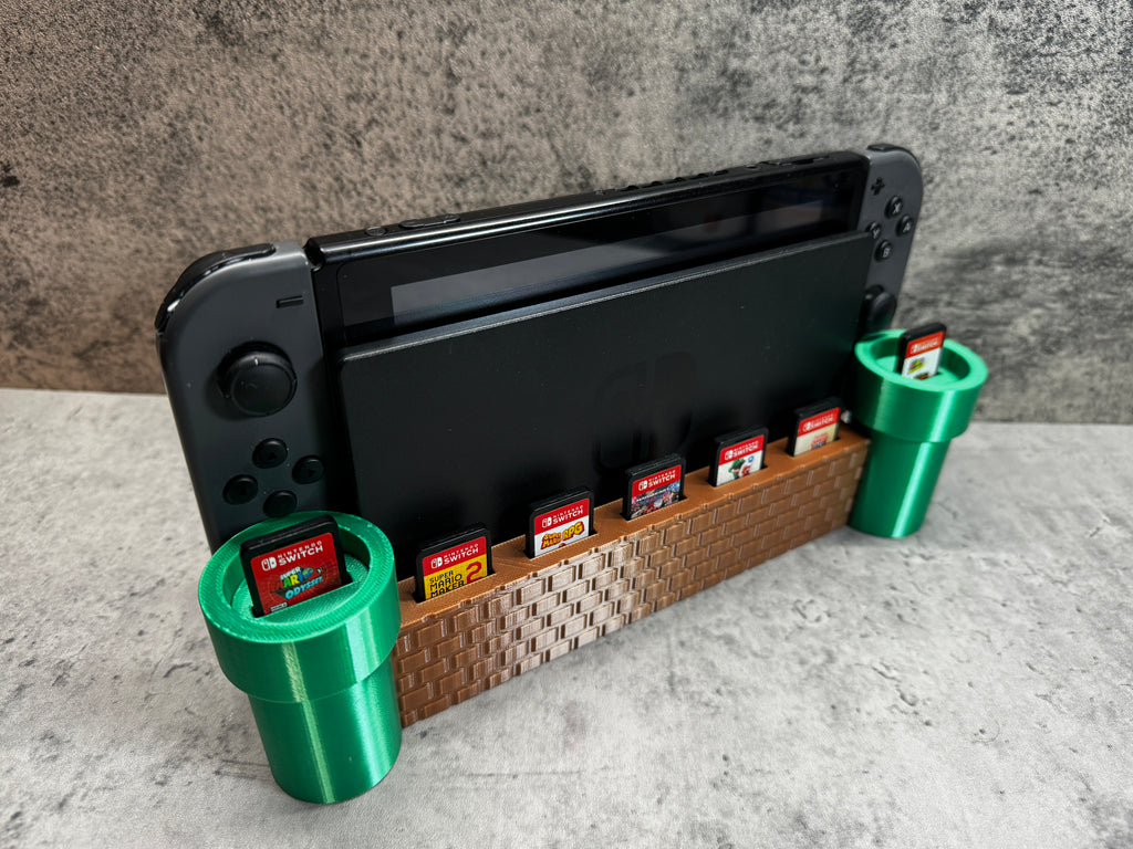a nintendo wii game system sitting on top of a shelf
