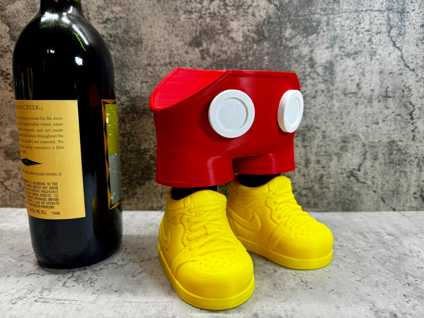 
                  
                    a bottle of wine and a pair of yellow shoes
                  
                