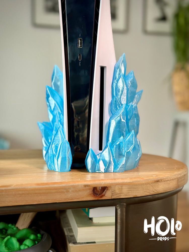 
                  
                    a table with a clock and some blue paper on it
                  
                