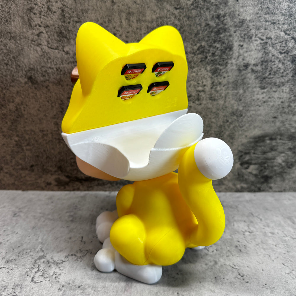 
                  
                    a yellow cat toy sitting on top of a table
                  
                