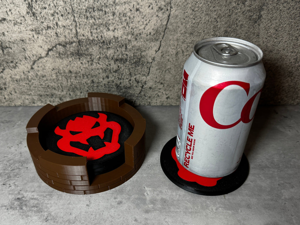 a can of coca cola next to a coaster