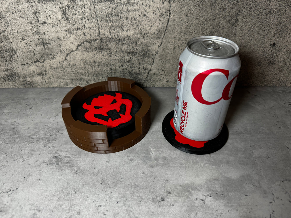 
                  
                    a can of coca cola next to a coaster
                  
                