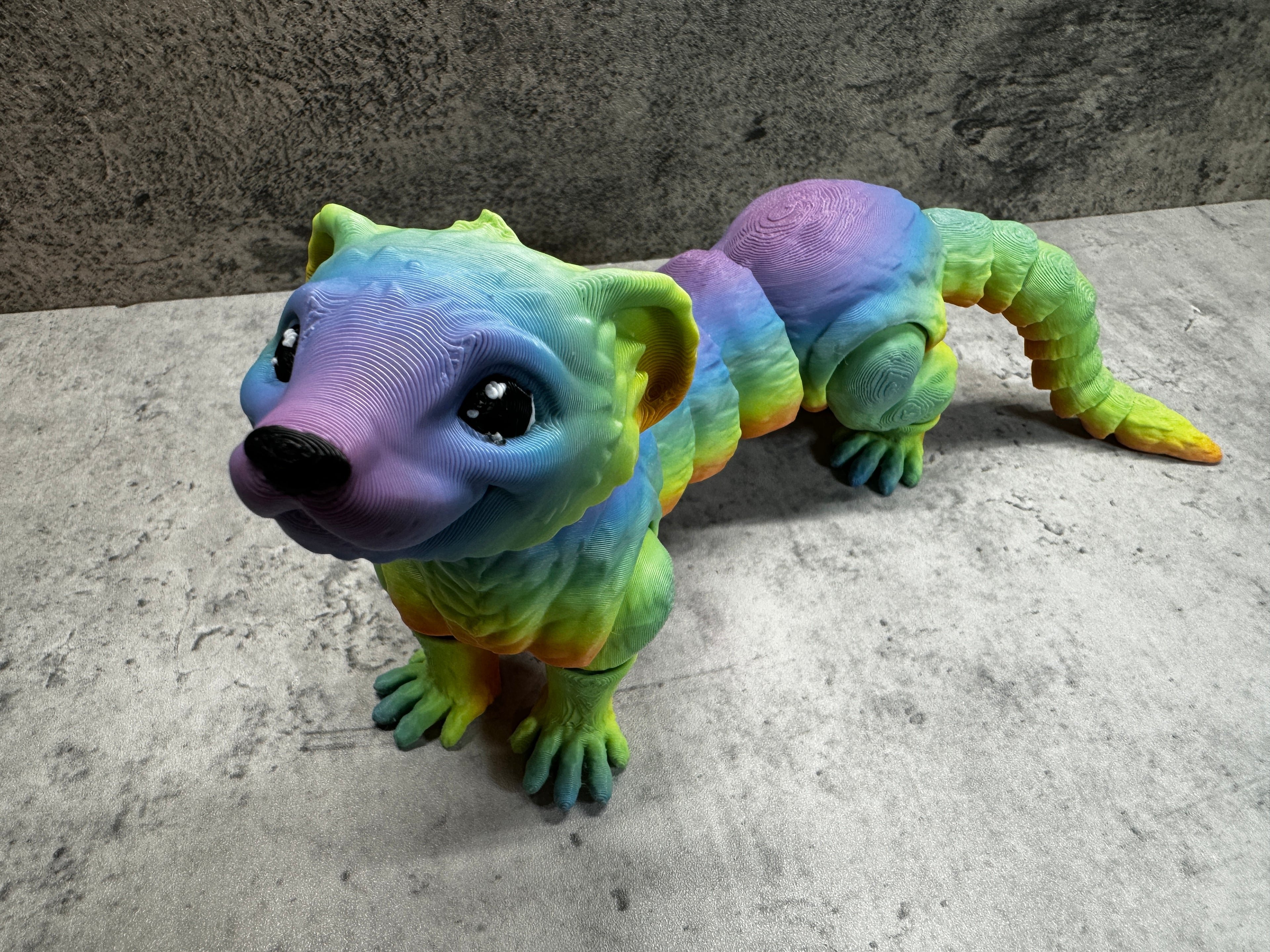 a toy animal that is laying down on the ground