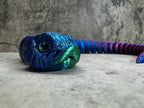 a close up of a blue and purple object on a wall