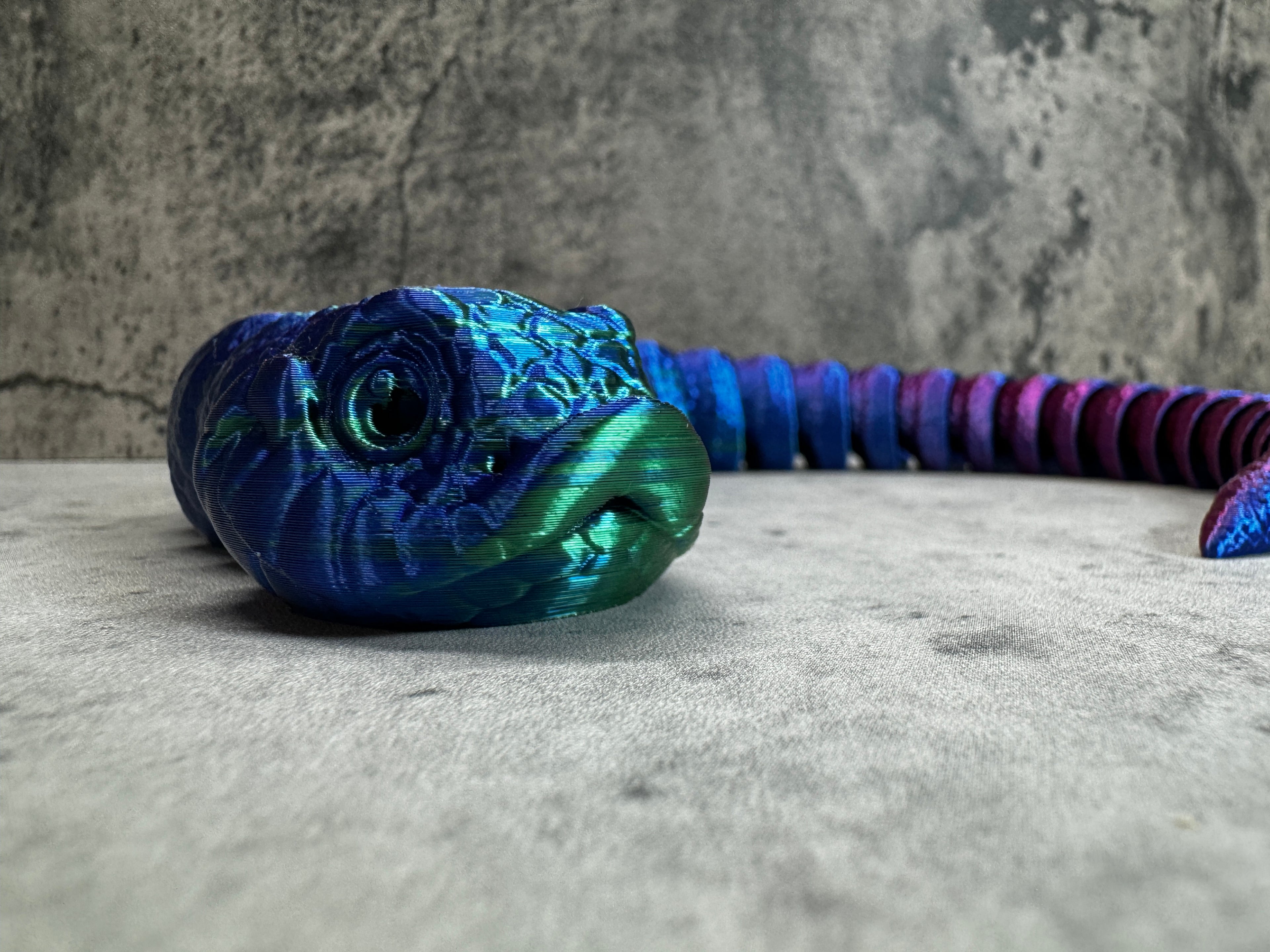 a close up of a blue and purple object on a wall